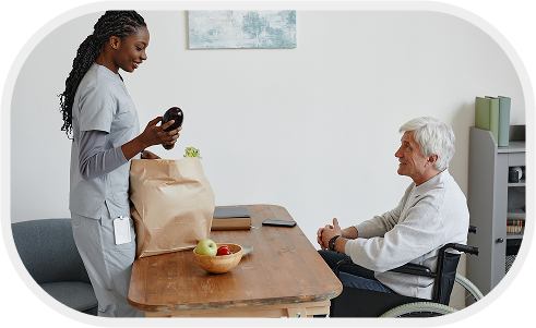 nurse-delivering-bag-with-groceries-senior-man-with-disability